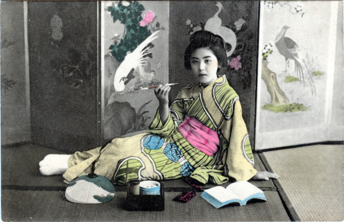 Onnanoko & Japanese tobacco pipe, c. 1910.