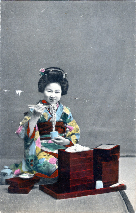 Eating noodles, c. 1910.