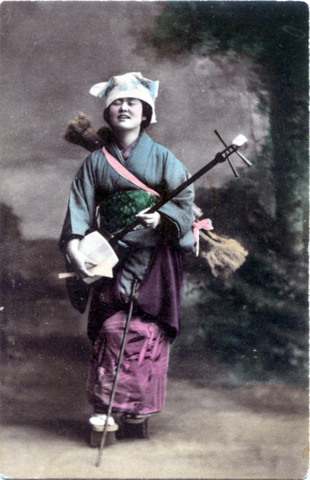 Samisen player, c. 1910.