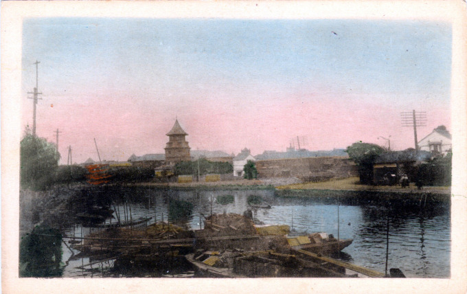 The tower of Rikkyo University rises above the foreign settlement at Tsukiji, c. 1900.