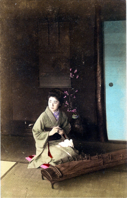Koto player and ikebana, c. 1910.