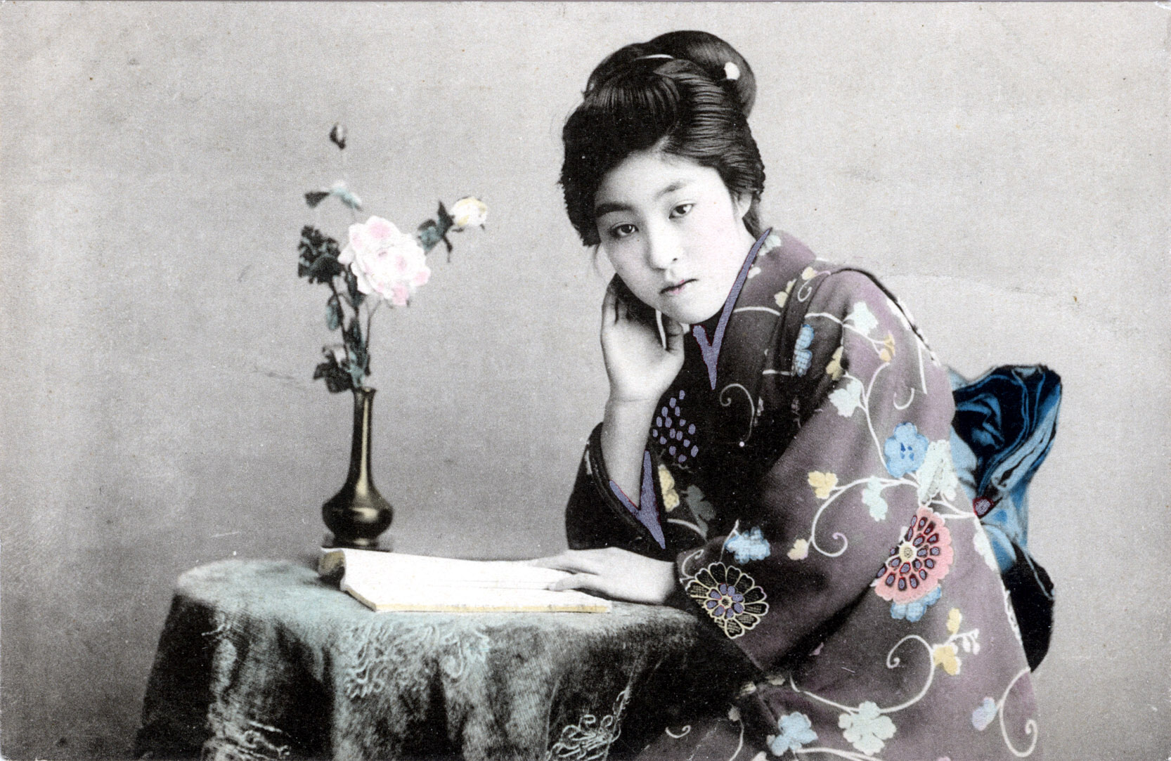 Maiko with ikebana arrangement in Western vase, c. 1910. 